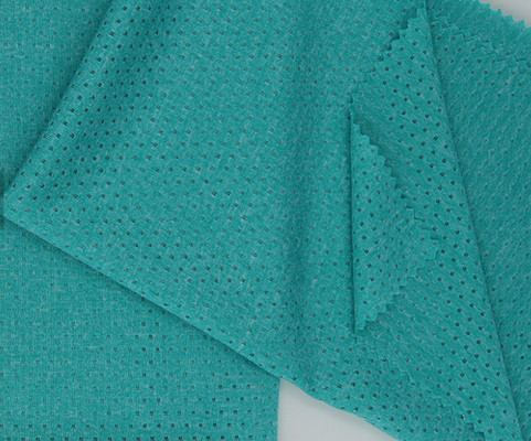 Il Jersey cationico verde del jacquard di Heather tricotta la morbidezza del tessuto con i fori della farfalla